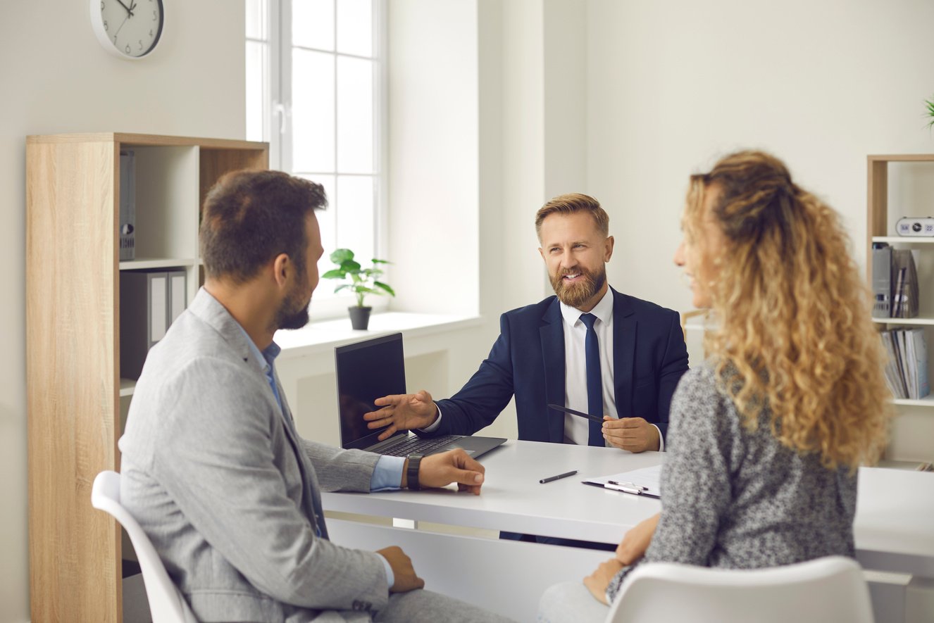 Couple Meeting with Insurance Broker, Bank Manager, Real Estate Agent or Mortgage Advisor